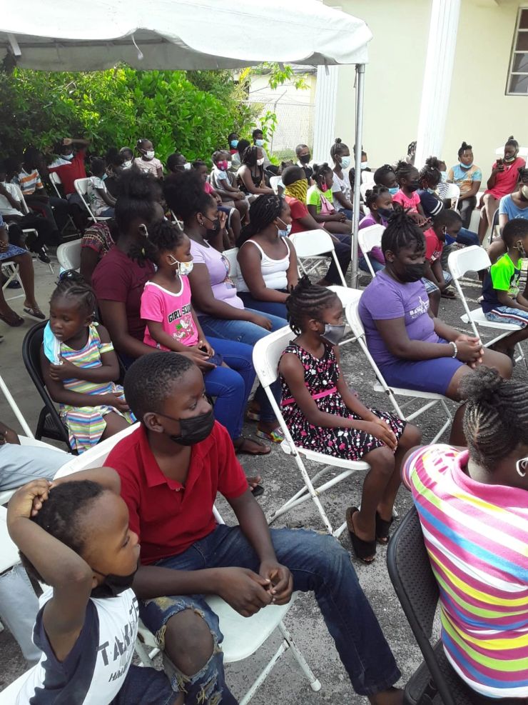 Families and children sharing a community gathering