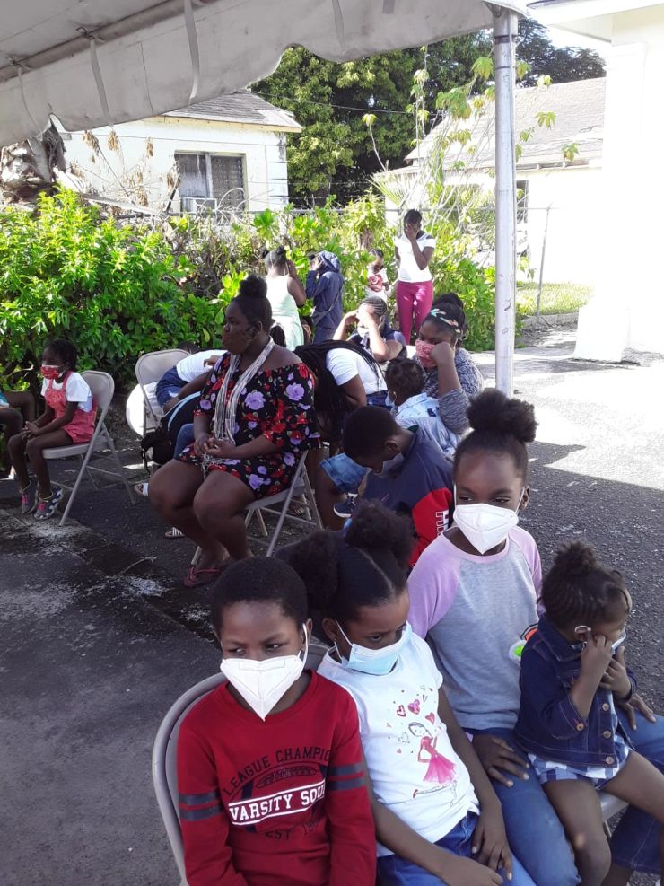 Children gathered beneath the canopy