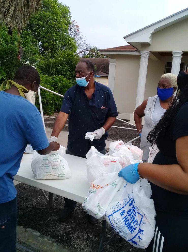 Volunteers working together at an outdoor table